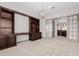 Bright home office with a view to the hall, custom built-in shelving and cabinet at 3816 E Expedition Way, Phoenix, AZ 85050