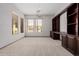 Spacious home office featuring custom built-in shelving and cabinets providing lots of storage space at 3816 E Expedition Way, Phoenix, AZ 85050