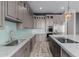 Spacious kitchen with stainless steel appliances, marble countertops, and a blue tile backsplash at 3816 E Expedition Way, Phoenix, AZ 85050