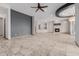 Expansive living room with a tiled fireplace, accent wall, and tan tiled flooring at 3816 E Expedition Way, Phoenix, AZ 85050