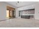 Open-concept space featuring tile flooring, ample natural light, and access to the outdoor patio at 3816 E Expedition Way, Phoenix, AZ 85050