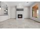 Spacious living room featuring a stylish fireplace and an open bar area at 3816 E Expedition Way, Phoenix, AZ 85050