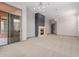 Bright living room with a modern fireplace, large windows and easy access to the backyard at 3816 E Expedition Way, Phoenix, AZ 85050