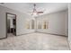 Living room with natural light, travertine floors, and views of the backyard at 3816 E Expedition Way, Phoenix, AZ 85050