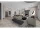 Virtually staged spacious living room featuring a fireplace and an open floor plan at 3816 E Expedition Way, Phoenix, AZ 85050