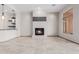 Bright living room with a tiled fireplace and tan tiled flooring at 3816 E Expedition Way, Phoenix, AZ 85050