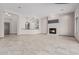 Spacious living room features a tiled fireplace and tan tiled flooring at 3816 E Expedition Way, Phoenix, AZ 85050