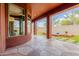 Covered outdoor patio with decorative concrete and manicured landscaping at 3816 E Expedition Way, Phoenix, AZ 85050