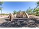 Outdoor rock climbing area with artificial rock formations and a safe, fun environment for all ages at 3816 E Expedition Way, Phoenix, AZ 85050