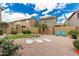 Spacious backyard featuring desert landscaping, synthetic grass, and a low block wall at 3940 E Geronimo St, Gilbert, AZ 85295
