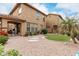 Expansive backyard features desert landscaping, gravel, and a covered patio for outdoor entertaining at 3940 E Geronimo St, Gilbert, AZ 85295