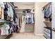 Spacious walk-in closet with built-in shelving and hanging racks for organized storage at 3940 E Geronimo St, Gilbert, AZ 85295