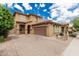 Two-story home featuring a tile roof, an attached garage, and a well-manicured front yard at 3940 E Geronimo St, Gilbert, AZ 85295