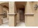 Inviting front entrance with a covered porch, decorative columns, and a welcoming door at 3940 E Geronimo St, Gilbert, AZ 85295