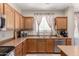 Spacious kitchen with stainless steel appliances and ample cabinet space for storage at 3940 E Geronimo St, Gilbert, AZ 85295