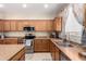 Kitchen featuring wooden cabinetry, stainless steel appliances, and functional countertops at 3940 E Geronimo St, Gilbert, AZ 85295