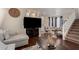 Open-concept living room with a view of the staircase and comfortable seating area at 3940 E Geronimo St, Gilbert, AZ 85295