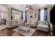 Spacious living room with a large sectional sofa and view to a green space at 3940 E Geronimo St, Gilbert, AZ 85295