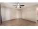 Bedroom with tiled floor, ceiling fan and closet doors at 4158 E Crescent Ave, Mesa, AZ 85206