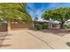 Charming single-story home featuring a two-car garage, desert landscaping and mature shade trees at 4158 E Crescent Ave, Mesa, AZ 85206