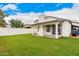 Spacious backyard with lush grass and a covered patio, perfect for outdoor living and entertaining at 4319 E Contessa St, Mesa, AZ 85205