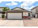 Charming single-story home featuring a spacious two-car garage and low maintenance landscaping at 4319 E Contessa St, Mesa, AZ 85205