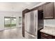 Bright kitchen featuring stainless steel appliances, granite countertops, dark cabinets and open concept at 4319 E Contessa St, Mesa, AZ 85205