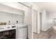 Bright laundry room with modern appliances and shelving for storage at 4319 E Contessa St, Mesa, AZ 85205