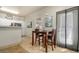 Dining area off of kitchen with a dining set and large window at 5303 N 7Th St # 118, Phoenix, AZ 85014
