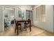 Dining area with tile flooring, table with seating, and view of bedroom at 5303 N 7Th St # 118, Phoenix, AZ 85014