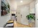 View of the front door with a table, plant, and decor throughout entryway at 5303 N 7Th St # 118, Phoenix, AZ 85014