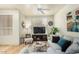 Cozy living room with bright neutral tones, ceiling fan, and natural light at 5303 N 7Th St # 118, Phoenix, AZ 85014
