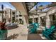 Outdoor lounge area with colorful seating, shade structures, and stylish decor at 5303 N 7Th St # 118, Phoenix, AZ 85014