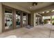 Outdoor patio with multiple glass doors leading to the community amenities at 5303 N 7Th St # 118, Phoenix, AZ 85014