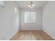 Bright and airy room featuring wood flooring, a neutral color palette, and a large window at 5312 W Hardtack Trl, Laveen, AZ 85339