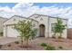 Charming single-story home with an arched porch, a brick driveway, and desert landscaping at 5312 W Hardtack Trl, Laveen, AZ 85339