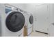 Laundry room featuring a washer and dryer set and a white door at 5312 W Hardtack Trl, Laveen, AZ 85339