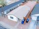 Aerial view of a charming house with fenced yard and detached garage at 576 N Pasadena --, Mesa, AZ 85201