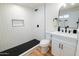Modern bathroom featuring white subway tile, black hardware, and updated vanity at 576 N Pasadena --, Mesa, AZ 85201