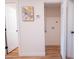 Hallway featuring wood-look floors, access to the laundry, bathroom, and bedrooms at 576 N Pasadena --, Mesa, AZ 85201