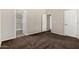 Neutral bedroom featuring open access to a bathroom and two interior doors at 5901 E Leonora St, Mesa, AZ 85215