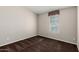 Neutral bedroom featuring a window and neutral carpeting at 5901 E Leonora St, Mesa, AZ 85215