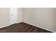 Neutral bedroom featuring a white interior door and neutral carpeting at 5901 E Leonora St, Mesa, AZ 85215