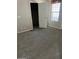 Carpeted bedroom with a window and a large closet at 5901 E Leonora St, Mesa, AZ 85215
