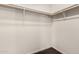 Walk-in closet featuring clothing rods and neutral carpeting at 5901 E Leonora St, Mesa, AZ 85215