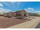 Charming one-story home boasts a screened-in porch and gravel landscaping for easy maintenance at 5901 E Leonora St, Mesa, AZ 85215