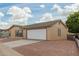 Charming one-story home featuring a two-car garage, gravel landscaping, and a clean exterior at 5901 E Leonora St, Mesa, AZ 85215