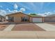 Charming single-story home featuring a two-car garage, low-maintenance landscaping, and a welcoming entrance at 5901 E Leonora St, Mesa, AZ 85215