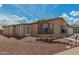 Charming one-story home with a screened-in porch and low-maintenance front yard landscaping at 5901 E Leonora St, Mesa, AZ 85215