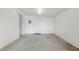 Spacious garage with concrete floors and white walls, ready for customization at 5901 E Leonora St, Mesa, AZ 85215